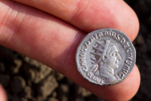 Ancient Roman silver coin showing the portrait of the emperor Ancient Roman silver coin showing the portrait of the emperor